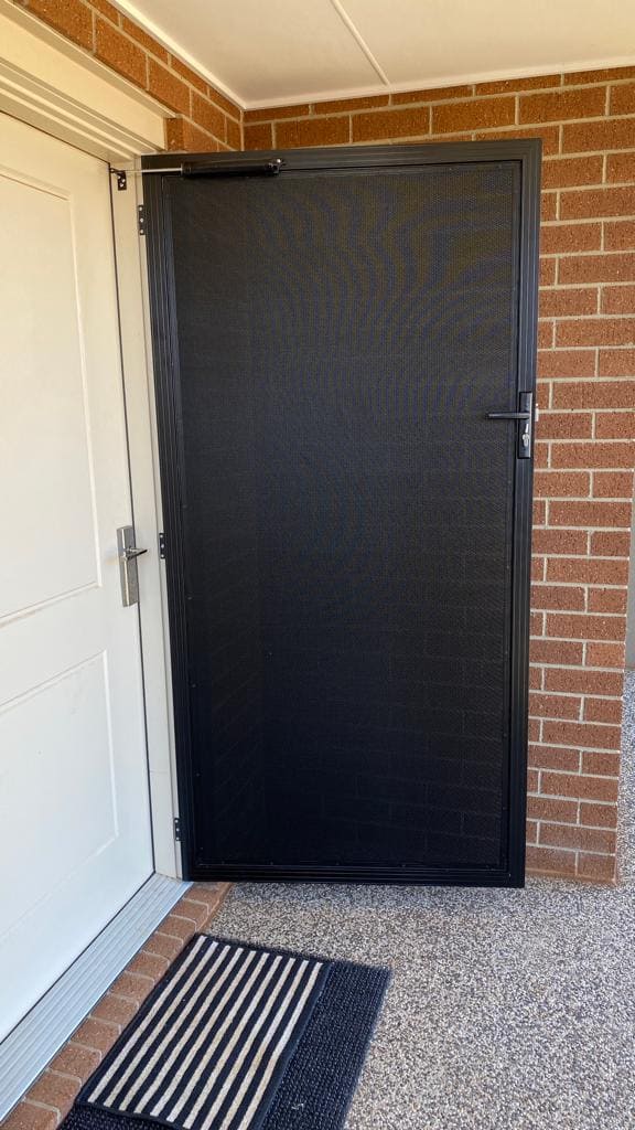 Perforated Mesh security door installed by Maple Blinds