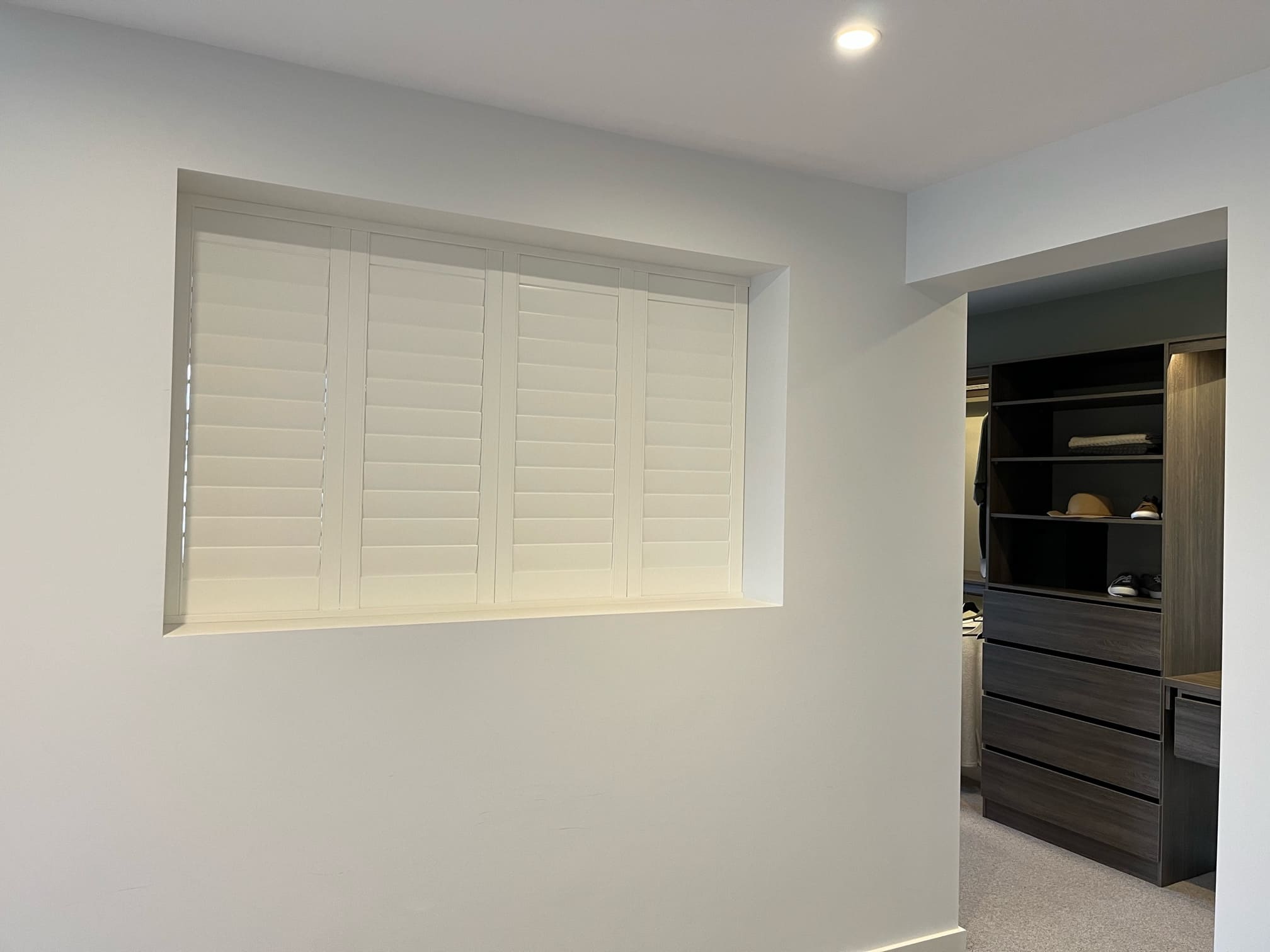 Plantation shutters in a bedroom