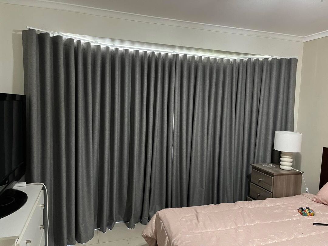 Charcoal blockout curtains in a bedroom