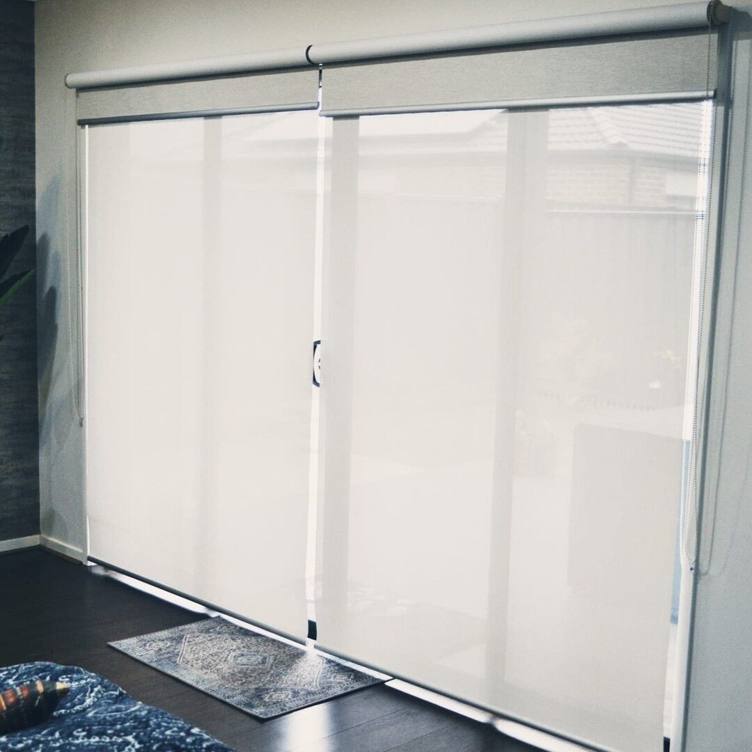 Sunscreen roller blinds on sliding doors