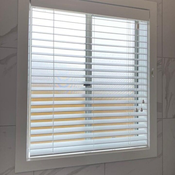 White venetian blind in a bathroom window