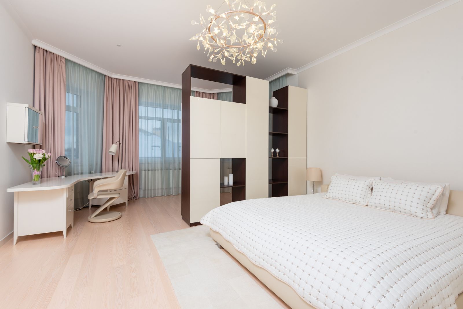 Two-tone curtains and sheers in a master bedroom